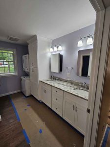 Stunning white bathroom remodel in Salem NH by Apple Wood Construction