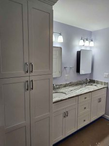 Stunning white bathroom remodel in Salem NH by Apple Wood Construction